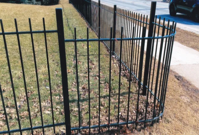 Custom steel fence bend in Courtice, Ontario circa 2000